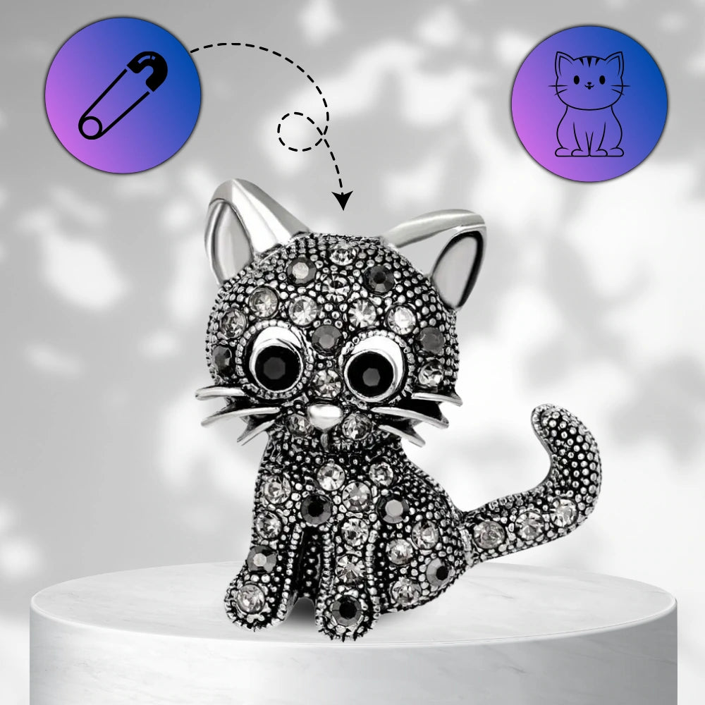 Eleganta melna kaķa piespraude, kas dekorēta ar cirkoniem
