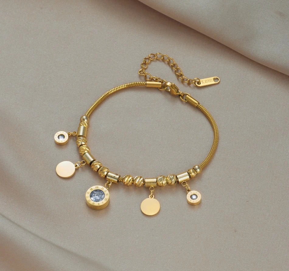 Zelta rokassprādze ar kuloniem, eleganta, ķirurģiskā tērauda