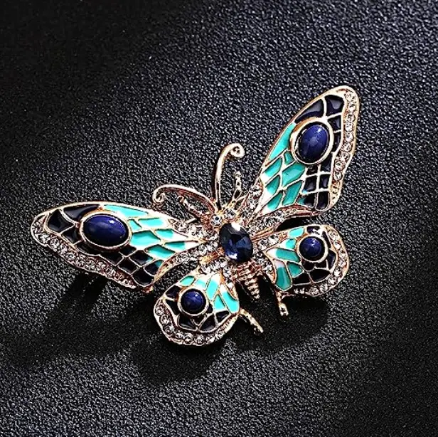 Retro stila tauriņa piespraude ar mākslīgajiem akmentiņiem